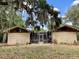 Property features a unique exterior design and screened patio that seamlessly blends indoor and outdoor living at 246 Ridge Manor Dr, Lake Wales, FL 33853