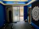 Home gym with weights, punching bag, and sliding glass door to outside at 246 Ridge Manor Dr, Lake Wales, FL 33853
