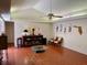 Bright living room with tile floors and a vaulted ceiling featuring a fan at 246 Ridge Manor Dr, Lake Wales, FL 33853