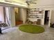 Living room with a green carpet and modern shelving at 246 Ridge Manor Dr, Lake Wales, FL 33853