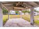 View from inside the carport looking out to the backyard and neighboring homes at 515 New York Ave, St Cloud, FL 34769