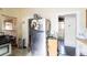 Spacious kitchen features stainless steel appliances, including a refrigerator, and access to the bathroom at 515 New York Ave, St Cloud, FL 34769