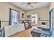 View of the living room with wood floor, blue trim and some furniture at 515 New York Ave, St Cloud, FL 34769