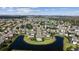 Aerial view showcasing the community's layout with ponds, manicured lawns, and diverse housing options at 13532 Meadow Bay Loop, Orlando, FL 32824