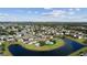 Aerial view of a community featuring ponds, green spaces, and well-maintained homes at 13532 Meadow Bay Loop, Orlando, FL 32824