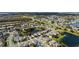 Wide aerial view of a neighborhood with houses, lakes, and green spaces on a sunny day at 13532 Meadow Bay Loop, Orlando, FL 32824