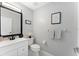 Contemporary half bathroom features modern fixtures, neutral walls, and stylish decor at 13532 Meadow Bay Loop, Orlando, FL 32824