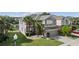 Expansive view showcasing the home's architectural design, landscaping, and surrounding neighborhood at 13532 Meadow Bay Loop, Orlando, FL 32824