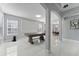 Spacious living room featuring lots of natural light, white trim, marble floors, and open floorplan at 13532 Meadow Bay Loop, Orlando, FL 32824