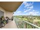 Relaxing balcony featuring comfortable seating and panoramic views of the city skyline and lush golf course at 4 Oceans West Blvd # 502B, Daytona Beach, FL 32118
