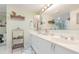 Bright bathroom with double sinks, turtle decor, and ample storage space, ideal for a household at 4 Oceans West Blvd # 502B, Daytona Beach, FL 32118