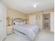A bright bedroom with a king bed and access to closet storage and the ensuite bath at 4 Oceans West Blvd # 502B, Daytona Beach, FL 32118