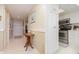 Inviting home entryway featuring tile floors, neutral walls, and access to a modern kitchen at 4 Oceans West Blvd # 502B, Daytona Beach, FL 32118