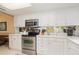 Modern kitchen featuring white cabinets and stainless steel appliances at 4 Oceans West Blvd # 502B, Daytona Beach, FL 32118