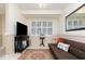 Inviting living room featuring plantation shutters and a comfortable seating area, perfect for relaxation at 4 Oceans West Blvd # 502B, Daytona Beach, FL 32118