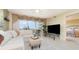 Stylish living room with neutral walls, large window, and seamless access to bedroom at 4 Oceans West Blvd # 502B, Daytona Beach, FL 32118