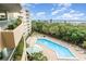 Tranquil pool area surrounded by lush landscaping, providing a serene and relaxing escape with plenty of lounge chairs at 4 Oceans West Blvd # 502B, Daytona Beach, FL 32118