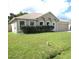 Charming single-story home with a well-maintained lawn and attached two-car garage at 1118 Perpignan Ct, Kissimmee, FL 34759