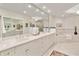 Bright bathroom featuring a double vanity with granite countertops and a soaking tub at 8749 The Esplanade # 6, Orlando, FL 32836