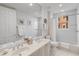 Well-lit bathroom with double sinks, ample counter space, and a shower-tub combination at 8749 The Esplanade # 6, Orlando, FL 32836