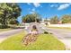 Elegant Vizcaya community entrance sign with lush landscaping and a clear blue sky backdrop at 8749 The Esplanade # 6, Orlando, FL 32836
