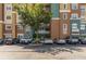 Well-maintained condo exterior with colorful facade, balconies and parking lot for residents at 8749 The Esplanade # 6, Orlando, FL 32836
