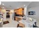Bright kitchen with stainless steel appliances, breakfast bar, and tiled flooring at 8749 The Esplanade # 6, Orlando, FL 32836
