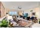 Comfortable living room featuring a fireplace, plush seating, and scenic water views at 8749 The Esplanade # 6, Orlando, FL 32836
