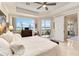 Serene main bedroom features water views, neutral tones, and access to a private balcony at 8749 The Esplanade # 6, Orlando, FL 32836