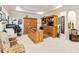 Spacious home office with custom wood built-ins, ample workspace, and stylish decor at 8749 The Esplanade # 6, Orlando, FL 32836