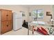 Versatile recreation room with pinball machine, refrigerator, and fitness equipment at 8749 The Esplanade # 6, Orlando, FL 32836