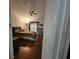 Cozy bedroom with hardwood floors, ceiling fan, and a comfortable queen-sized bed at 15824 Green Cove Blvd, Clermont, FL 34714