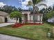 Charming single-story home featuring a well-manicured lawn and mature landscaping at 15824 Green Cove Blvd, Clermont, FL 34714