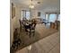 Open-concept living and dining area with tile flooring, comfortable seating, and plenty of natural light at 15824 Green Cove Blvd, Clermont, FL 34714