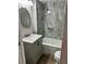 Clean bathroom with a white vanity, silver hardware, and a tiled shower/tub combo at 311 James Ave, Auburndale, FL 33823