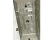 Beautifully tiled shower stall with a modern shower head and fixtures at 311 James Ave, Auburndale, FL 33823