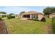 Spacious backyard features green lawn, patio, and lush landscaping at 8166 Sw 80Th Ter, Ocala, FL 34476