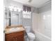 Neutral bathroom featuring wood vanity and shower/tub combo at 8166 Sw 80Th Ter, Ocala, FL 34476
