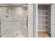 Bathroom shower with glass doors and a shelving unit at 8166 Sw 80Th Ter, Ocala, FL 34476