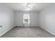 Bedroom featuring neutral colored walls, carpet and ceiling fan at 8166 Sw 80Th Ter, Ocala, FL 34476