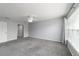 Inviting bedroom with soft carpet, ceiling fan, and a window for natural light at 8166 Sw 80Th Ter, Ocala, FL 34476