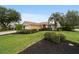 Well-maintained single-story home with manicured lawn and decorative mulch beds at 8166 Sw 80Th Ter, Ocala, FL 34476