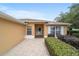 Inviting single-story home with a beautiful brick walkway and manicured landscaping at 8166 Sw 80Th Ter, Ocala, FL 34476