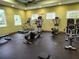 The fitness center includes treadmills and elliptical machines for a complete cardio workout, complemented by ample natural light at 8166 Sw 80Th Ter, Ocala, FL 34476