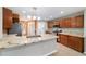 Modern kitchen with granite countertops, stainless steel appliances, and ample cabinet space at 8166 Sw 80Th Ter, Ocala, FL 34476
