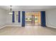 Brightly lit living area with large sliding glass doors leading to the patio at 8166 Sw 80Th Ter, Ocala, FL 34476