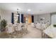 Open layout features living and dining area, with sliding glass doors leading to the outdoor area and access to the kitchen at 8166 Sw 80Th Ter, Ocala, FL 34476