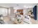 Open-concept living room flows into the dining area and kitchen with modern finishes and lots of natural light at 8166 Sw 80Th Ter, Ocala, FL 34476
