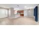 Open-concept living and kitchen area featuring wood-look floors and neutral tones at 8166 Sw 80Th Ter, Ocala, FL 34476