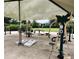 A community outdoor gym offers various exercise equipment and cornhole boards, shaded for comfortable workouts at 8166 Sw 80Th Ter, Ocala, FL 34476